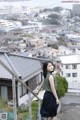 A woman standing on top of a metal railing.