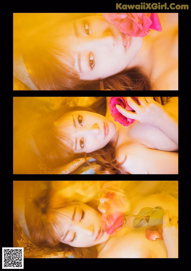 A woman laying on a bed with a flower in her hair.